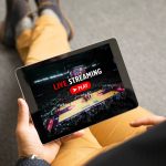 Man watching sports on live streaming online service